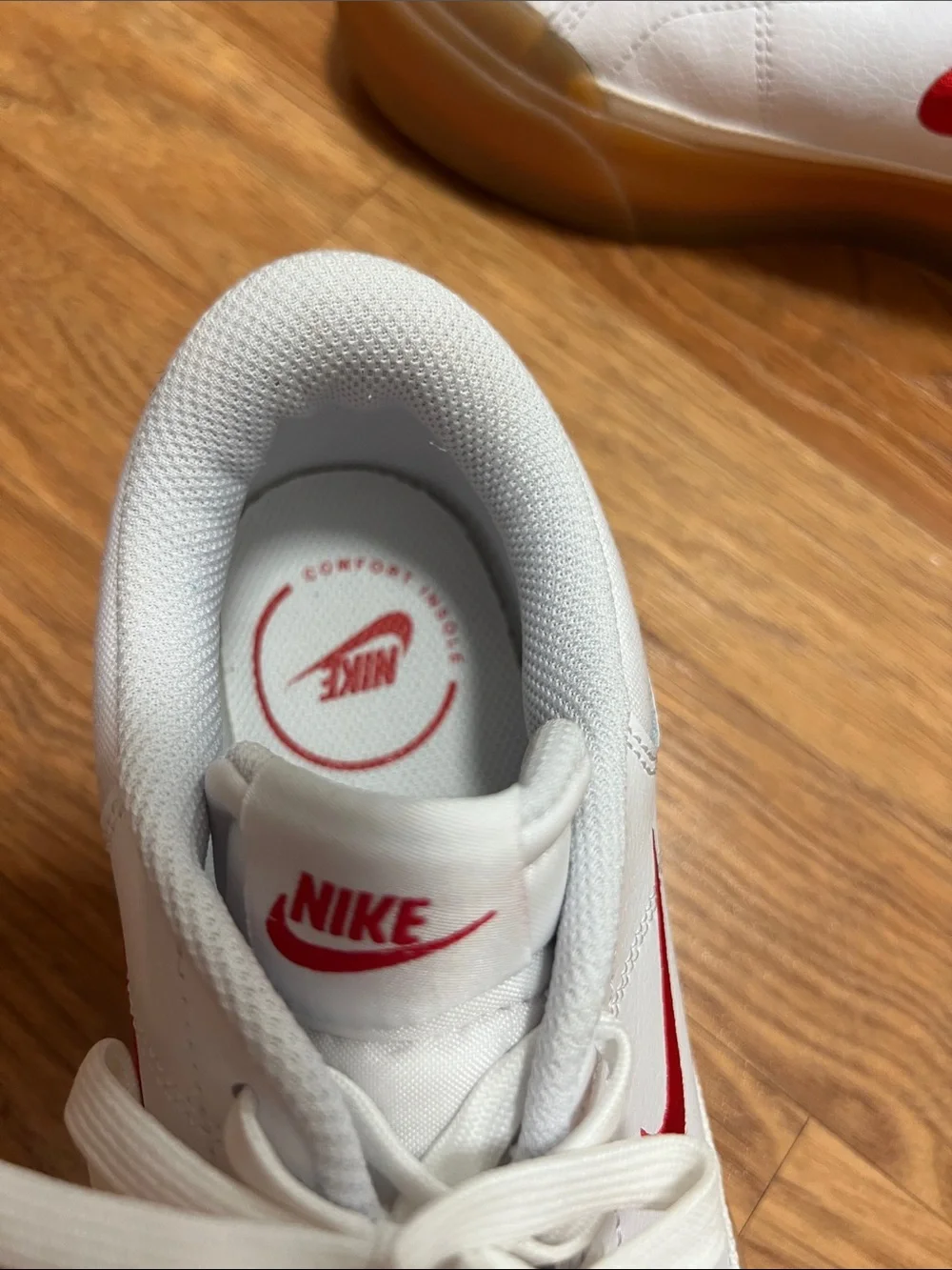 Nike White Leather Sneakers with Red Swoosh and Gum Sole